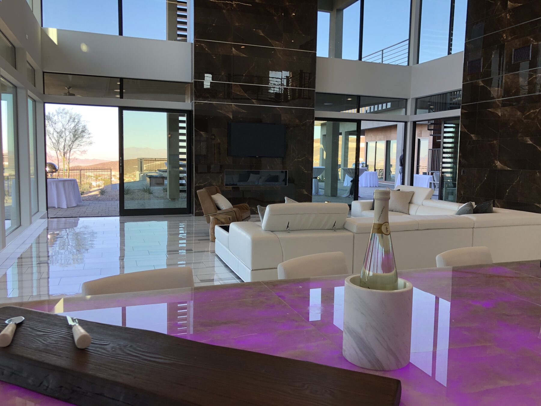 The onyx counter lit magenta at sunset, showing the color change the owner selects
